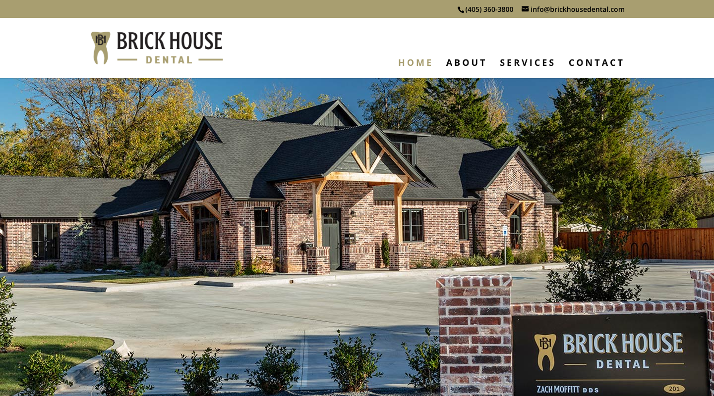 Homepage of Brickhouse Dental, showing the brick office building in Norman, Oklahoma.